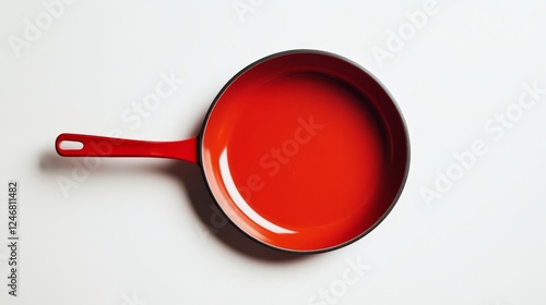 red frying pan on white background photo