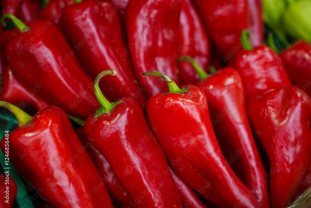Fresh red organic peppers on counter in farm shop, close-up. Sale of natural, organic vegetables, farming, healthy food. Fresh red organic peppers on counter in farm shop, close-up. Sale of natural, organic vegetables, farming, healthy food.