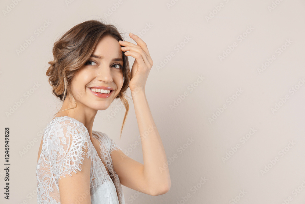 Young woman with beautiful hairstyle on beige background. Space for text Young woman with beautiful hairstyle on beige background. Space for text