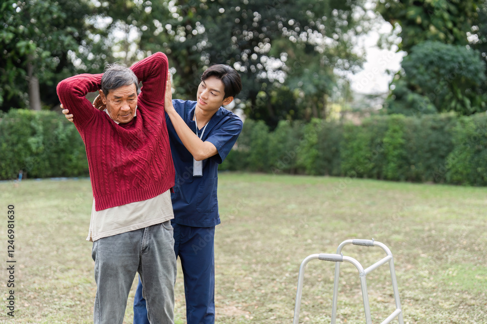 Obraz premium Health caregiver assisting elderly man with mobility in the park during rehabilitation therapy
