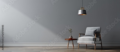Gray interior featuring armchair, side table, hanging lamp, and empty wall. Modern and minimalist style.