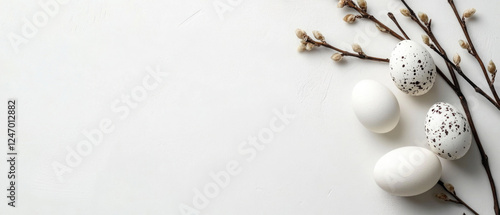 easter holiday greeting card, branch of a tree and pastell colored easter eggs isolated on white background