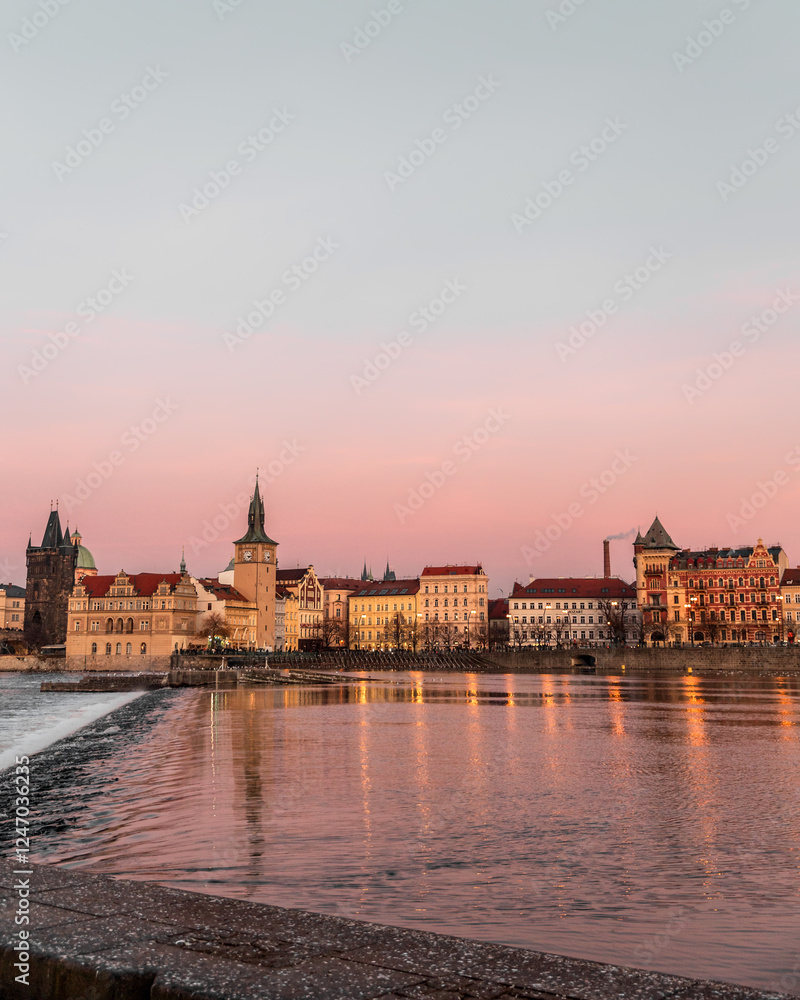 Obraz premium Sunset colors in Prague Historical Gothic Medieval castle, St. Vitus Cathedral, Charles Bridge and river Vltava boat cruise, astronomical clock, Unesco city tourism, golden hour and water reflection
