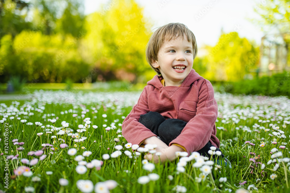 Adorable little boy having fun outdoors on sunny summer day. Kid running outdoors. Child exploring nature. Summer activities for kids. Adorable little boy having fun outdoors on sunny summer day. Kid running outdoors. Child exploring nature. Summer activities for kids.