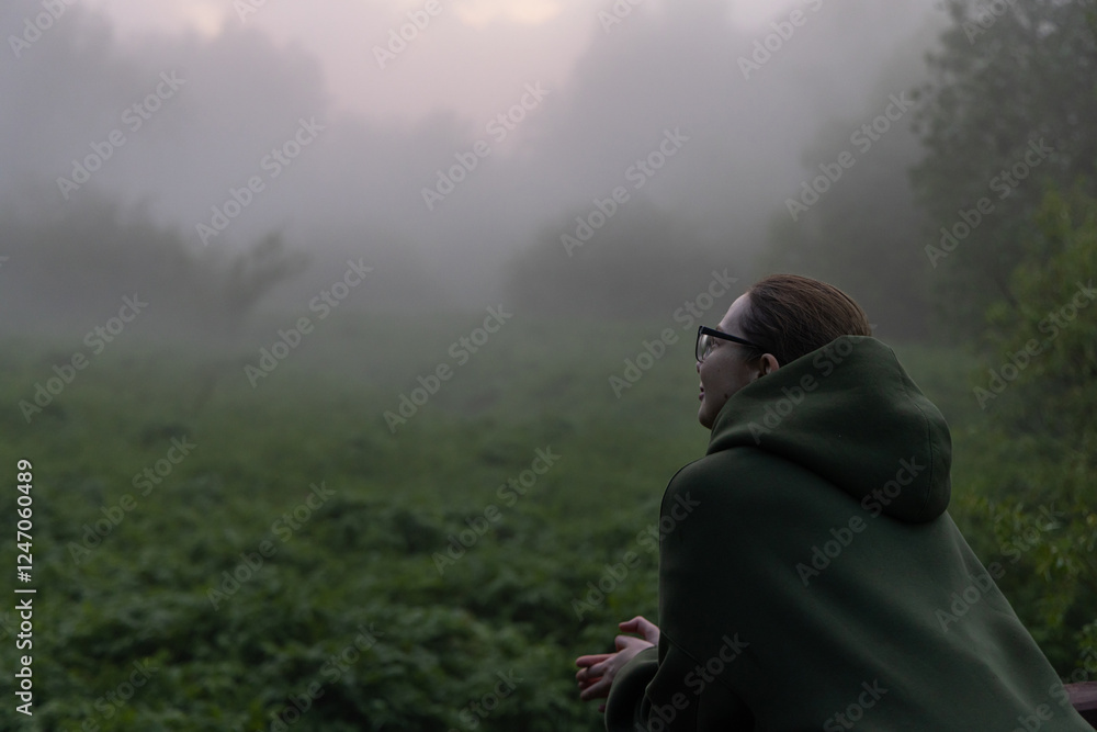 Captivating embrace of nature during a serene foggy morning in a lush green landscape Captivating embrace of nature during a serene foggy morning in a lush green landscape