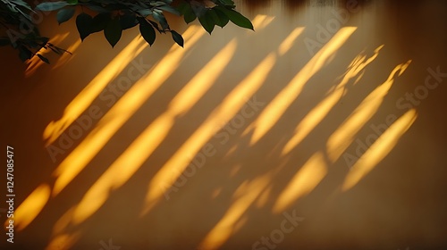 Golden sunlight casts leaf shadows on a wall