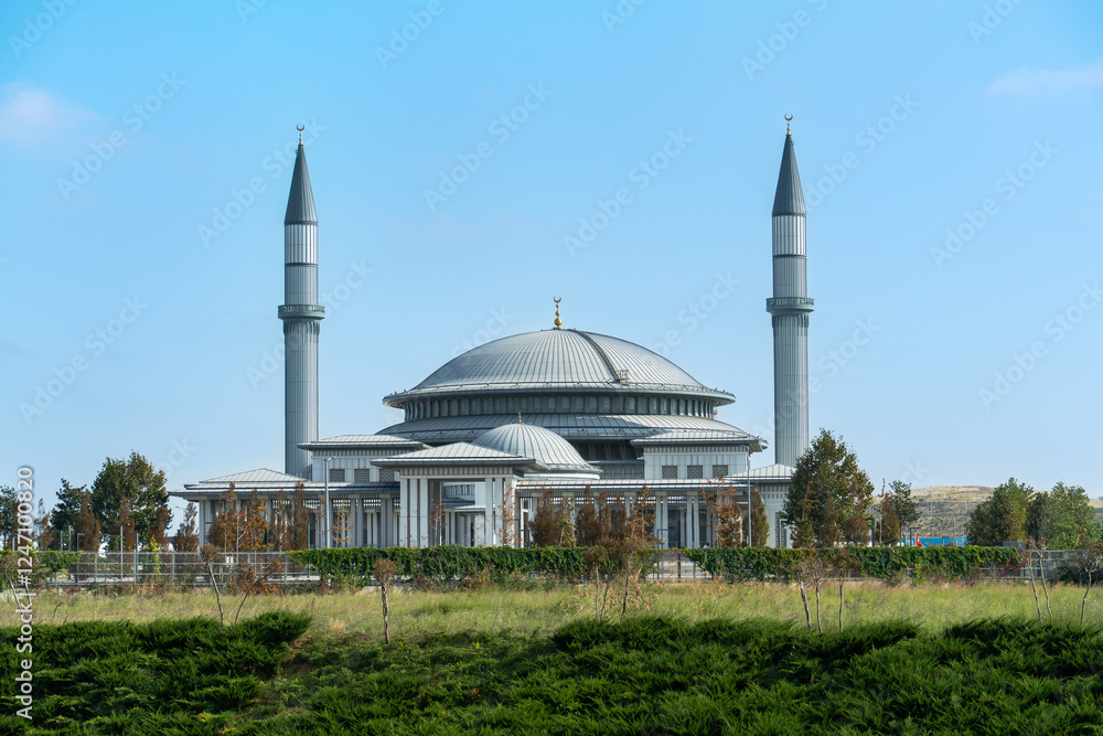Fototapeta premium Ali Kuşçu Mosque as seen from Istanbul Airport under clear blue sky.