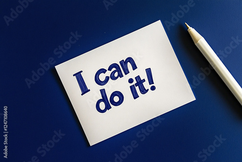 I can do it. Writing on white sheet of paper. Motivation. Doubts. Blue background.  Pencil nearby photo