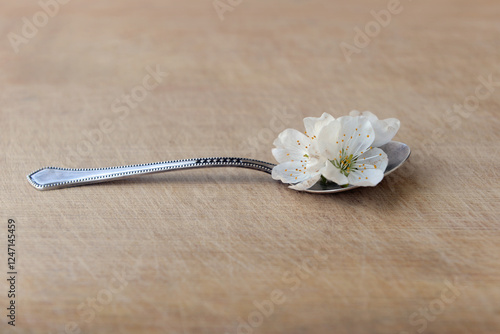 Spoon with a spring petals
