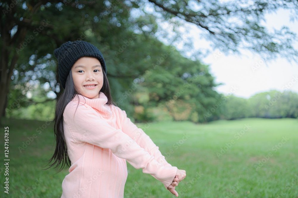A cheerful girl enjoying outdoor activities in a green park on a sunny day. A cheerful girl enjoying outdoor activities in a green park on a sunny day.