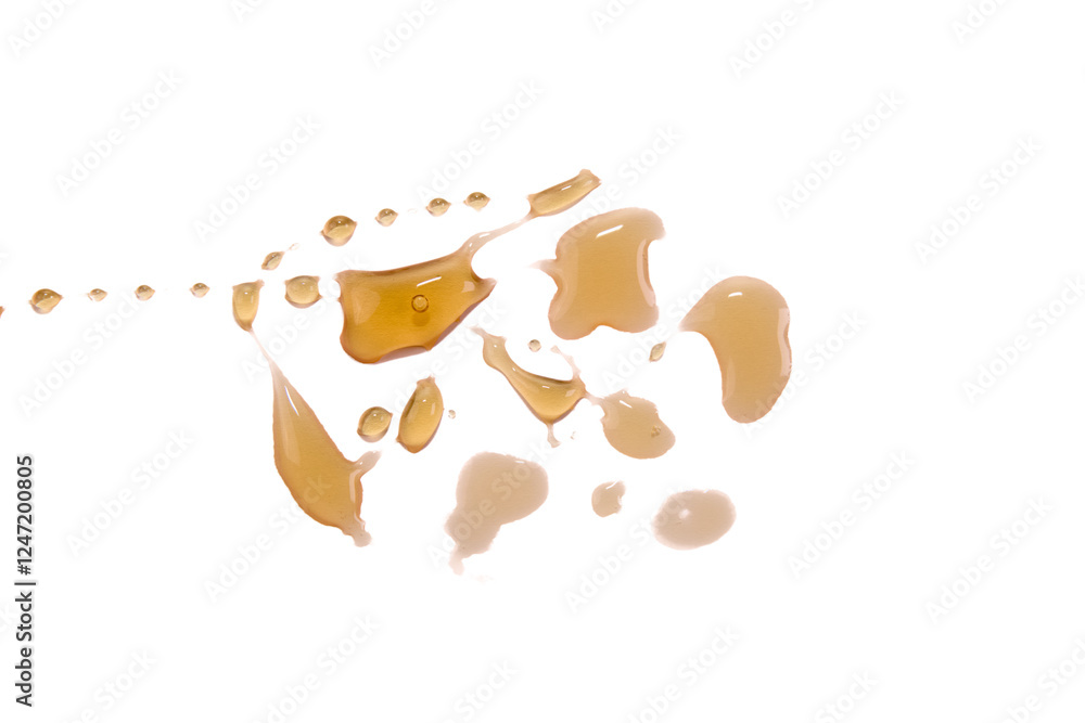 honey drops arrangement on a plain surface honey drops arrangement on a plain surface