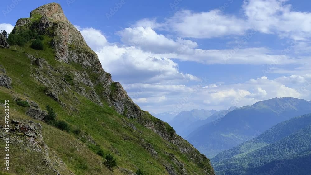 View of the mountain range near Mount Zakan. The top of the mountain node of the western part of the main ridge of the Greater Caucasus. Zakan Peak is the beginning of the Magisho mountain range. 4К View of the mountain range near Mount Zakan. The top of the mountain node of the western part of the main ridge of the Greater Caucasus. Zakan Peak is the beginning of the Magisho mountain range. 4К