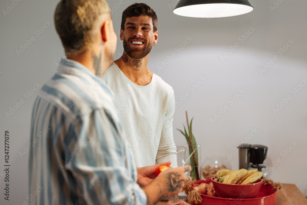 Two men happily cooking together in a cozy kitchen Two men happily cooking together in a cozy kitchen