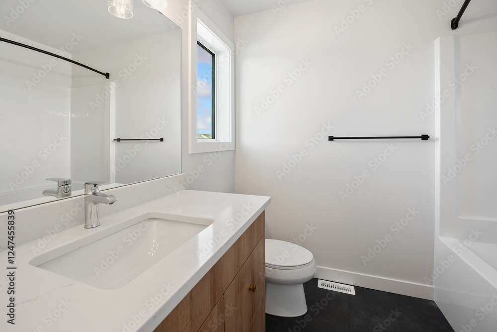 A bathroom with a white sink, toilet, and bathtub A bathroom with a white sink, toilet, and bathtub