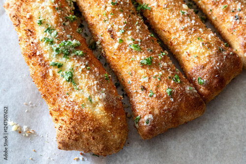Foto Detail of cheesy bread sticks, Italian cuisine.