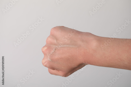 Obraz na plátně Woman with visible hand veins on light grey background, closeup