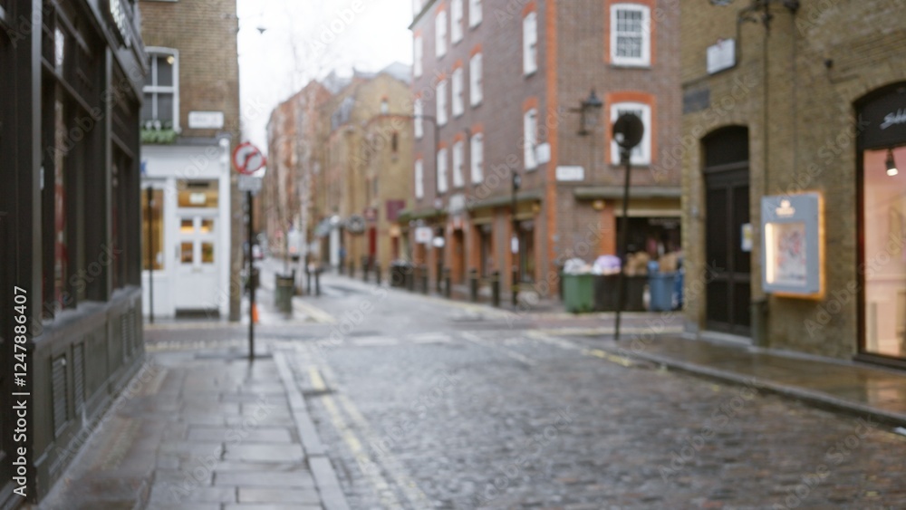 Blurred autumn street scene in london's seven dials, showcasing bokeh effects and historic architecture, with a focus on cobblestone paths and rainy uk weather. Blurred autumn street scene in london's seven dials, showcasing bokeh effects and historic architecture, with a focus on cobblestone paths and rainy uk weather.