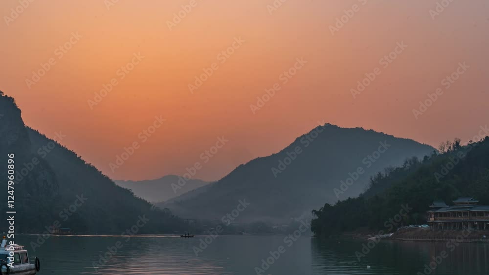 Sunset over the mountains reflecting on tranquil waters in an adobe landscape capturing nature's evening beauty Sunset over the mountains reflecting on tranquil waters in an adobe landscape capturing nature's evening beauty