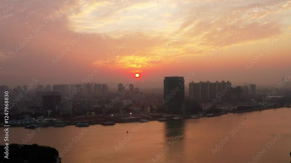 Sunrise over Zhujiang River showcasing stunning Guangzhou skyline and tranquil waters Sunrise over Zhujiang River showcasing stunning Guangzhou skyline and tranquil waters
