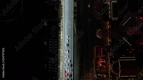 Top down aerial above the illuminated Las Vegas blvd at the Strip, night in USA