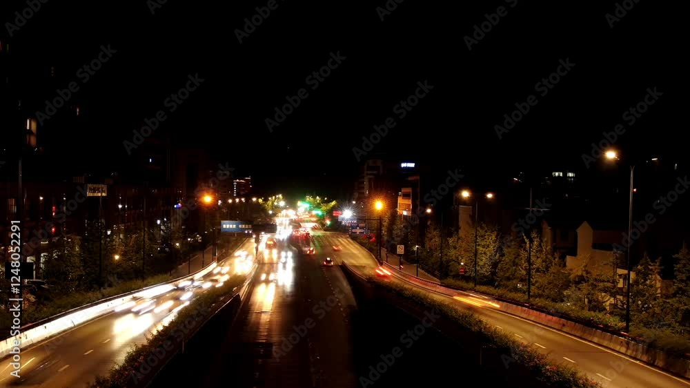 Urban viaduct traffic time lapse at night shows vibrant city movement and light patterns Urban viaduct traffic time lapse at night shows vibrant city movement and light patterns