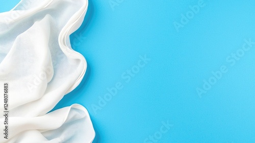 White fabric draped on blue background,  website design element photo