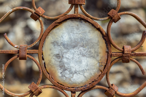 Detail of a stone decoration in the graveyard of Barichara, Santander, Colombia. Forged iron wit a stone circle.