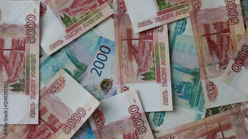 The currency of Russia. Close-up of Russian rubles. Financial concept. The background and texture of banknotes. Banknotes in denominations of 5000, 2000 and 1000 rubles. View from above