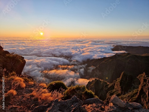 Breathtaking sunrise at Pico do Arieiro, sunrise above the clouds, hiking trial from Pico do Areerio to Pico do Ruivo. Madeira, Portugal photo