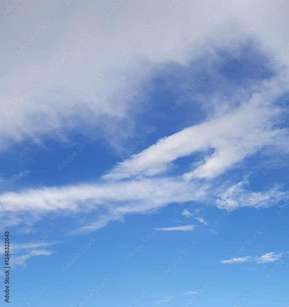 Bright Blue Sky with Soft White Clouds on a Clear Day, Perfect for a Peaceful and Serene View Bright Blue Sky with Soft White Clouds on a Clear Day, Perfect for a Peaceful and Serene View