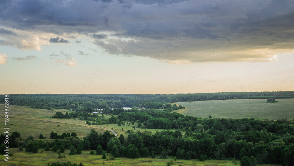 Fototapeta premium cloudy landscape at sunset in the countryside
