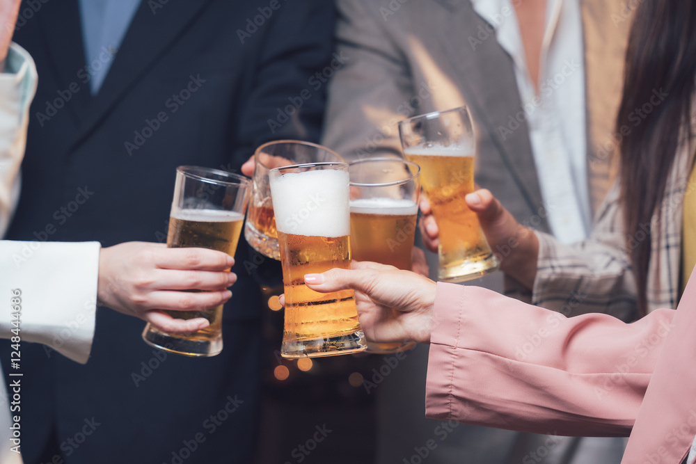 Cheers to Success: A group of colleagues raises their glasses in a celebratory toast, signifying a successful team effort and shared accomplishment. The image conveys a sense of unity, camaraderie. Cheers to Success: A group of colleagues raises their glasses in a celebratory toast, signifying a successful team effort and shared accomplishment. The image conveys a sense of unity, camaraderie.