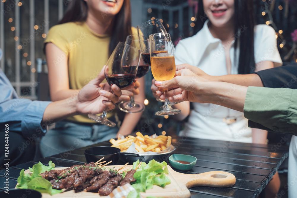 Cheers to Good Times: Close-up of friends raising glasses of red wine and champagne in a toast, celebrating together over a spread of grilled food and appetizers. Cheers to Good Times: Close-up of friends raising glasses of red wine and champagne in a toast, celebrating together over a spread of grilled food and appetizers.
