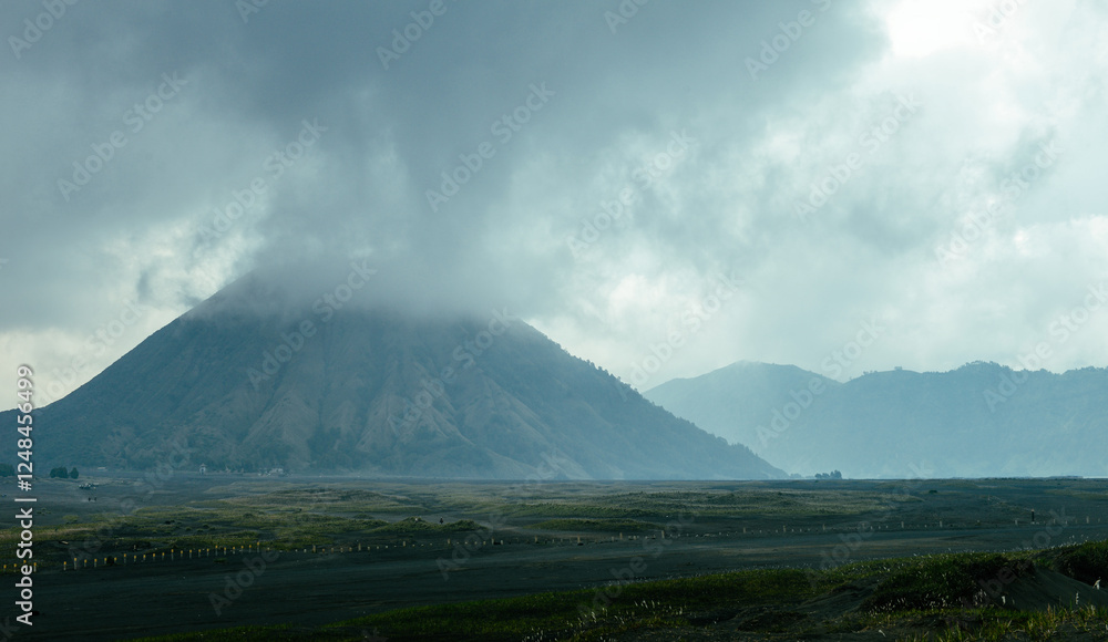 Fototapeta premium January winter, Bromo Volcano morning scenery seen from mountain foot, Indonesia