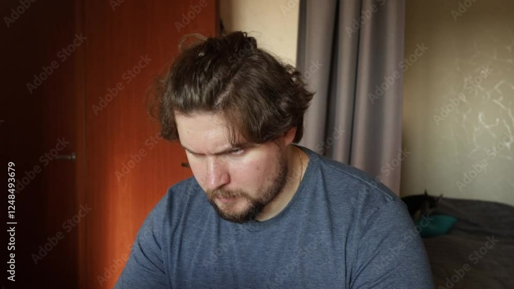 Angry man working on laptop, contempt for technology issues, working on freelance project. Angry man working on laptop, contempt for technology issues, working on freelance project.