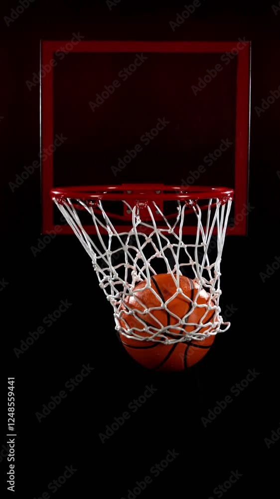 Super Slow Motion of Basketball Ball Hitting the Basket. Filmed on High Speed Cinema Camera, 1000fps. Camera in Motion. Vertical Aspect Ratio. Super Slow Motion of Basketball Ball Hitting the Basket. Filmed on High Speed Cinema Camera, 1000fps. Camera in Motion. Vertical Aspect Ratio.