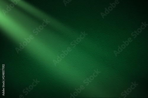 Fotografie Green light rays on dark green background