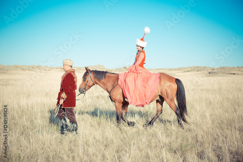 Kazakh woman and man in national costumes photo