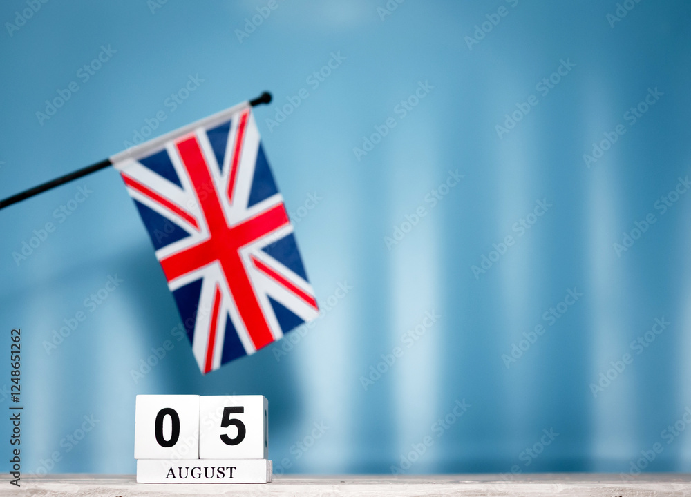 Fototapeta premium Calendar August With British Flag With Number 5. Calendar cubes with numbers. Space copy.