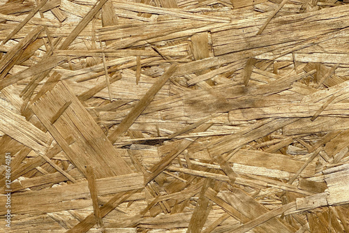 Texture of chipboard, OSB, sheet of building material. Background, backdrop for projects related to construction and repair. photo