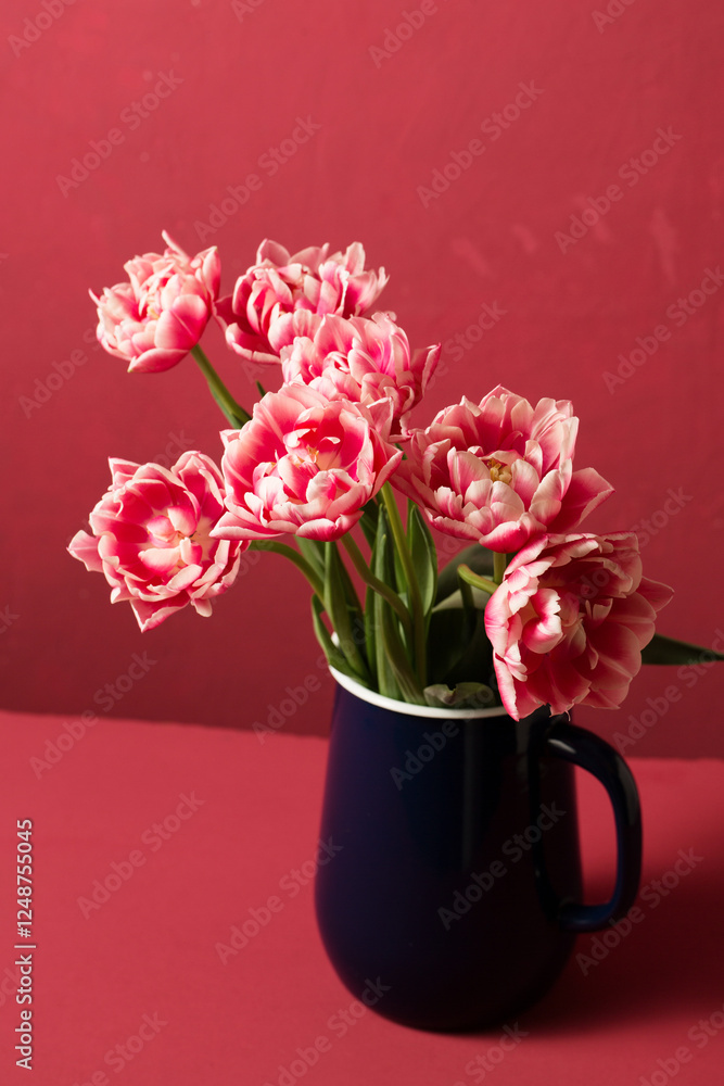 Beautiful pink terry tulips in a jug