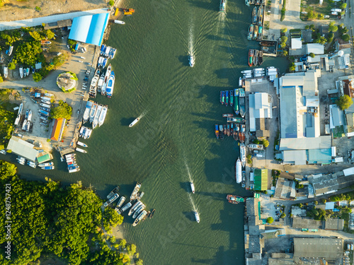 High angle view fisherman boats at the jetty located in Phuket Thailand, aerial view drone top down view,Siray fishing port Phuket Thailand photo