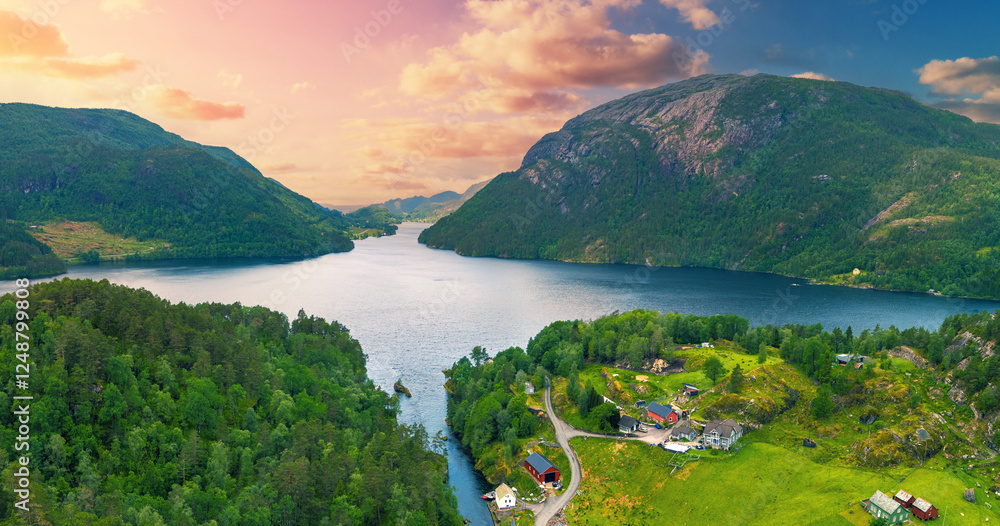 Panoramic view from above on mountain valley with lake Henangervatnet at sunset. Eikelandsosen, Norway, Europe. Horizontal banner