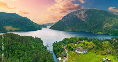 Panoramic view from above on mountain valley with lake Henangervatnet at sunset. Eikelandsosen, Norway, Europe. Horizontal banner photo