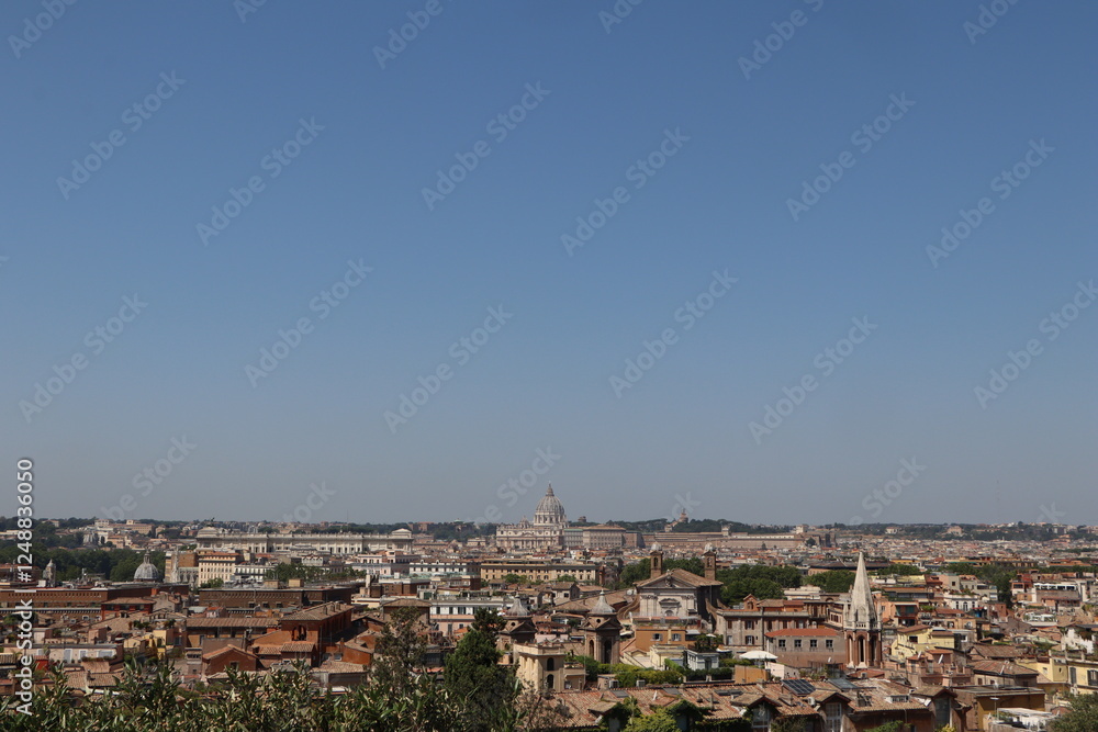 Obraz premium Panoramic view of Rome with historic buildings, domes, and a clear blue sky, showcasing the city's architectural beauty and rich cultural heritage