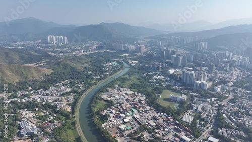 Explore the aerial view of urban development in Fanling Sheung Shui near  Lo Wu Hong Kong Shenzhen, where large tracts of farmland are being redeveloped into residential housing to address population  photo