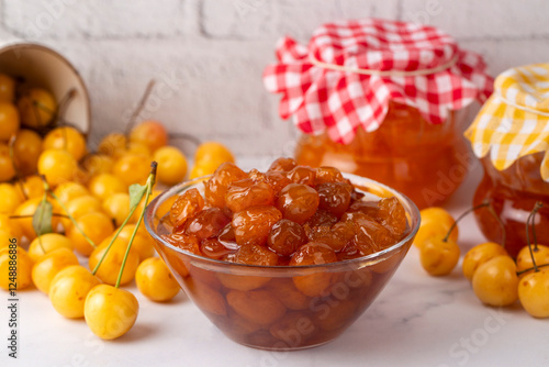 Obraz na płótnie Delicious yellow cherry jam in a jar w salonie