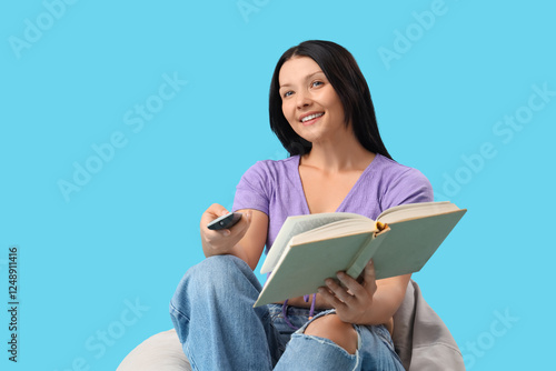 Pretty young woman reading ...
