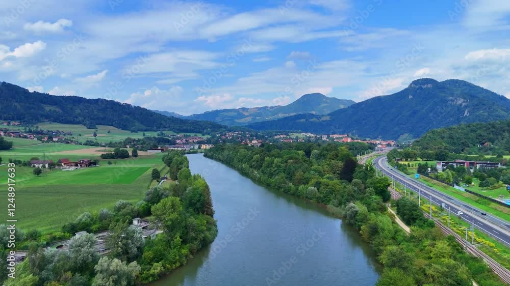 Aerial Drone View of a Lake Surrounded by Trees and Mountains on a Beautiful Day
Aerial Drone View of a Lake Surrounded by Trees and Mountains on a Beautiful Day