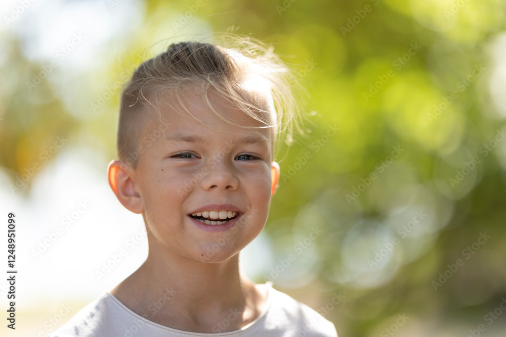Smiling child enjoying a sunny day outdoors Smiling child enjoying a sunny day outdoors